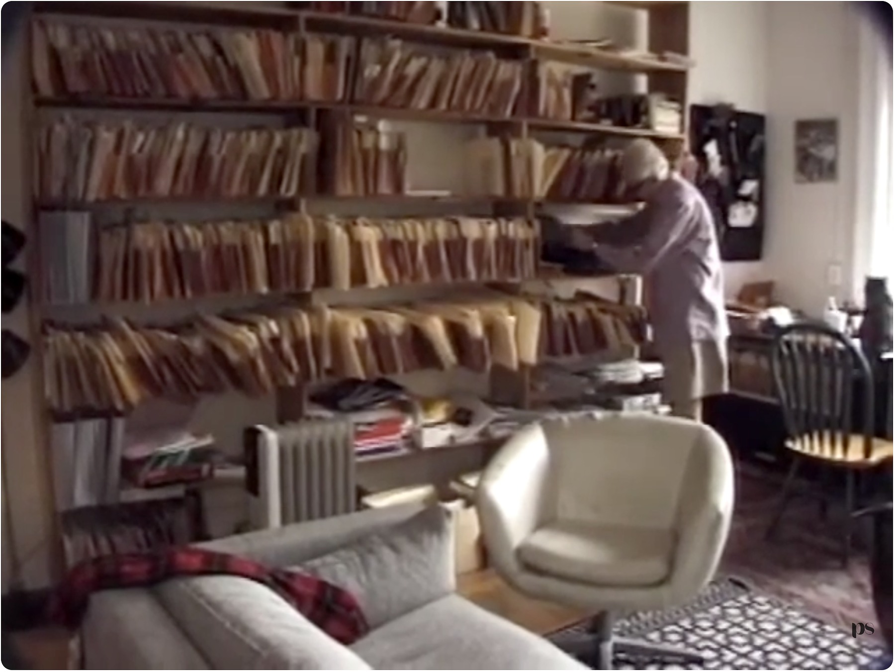 Henry Spira at work among his files and campaign material